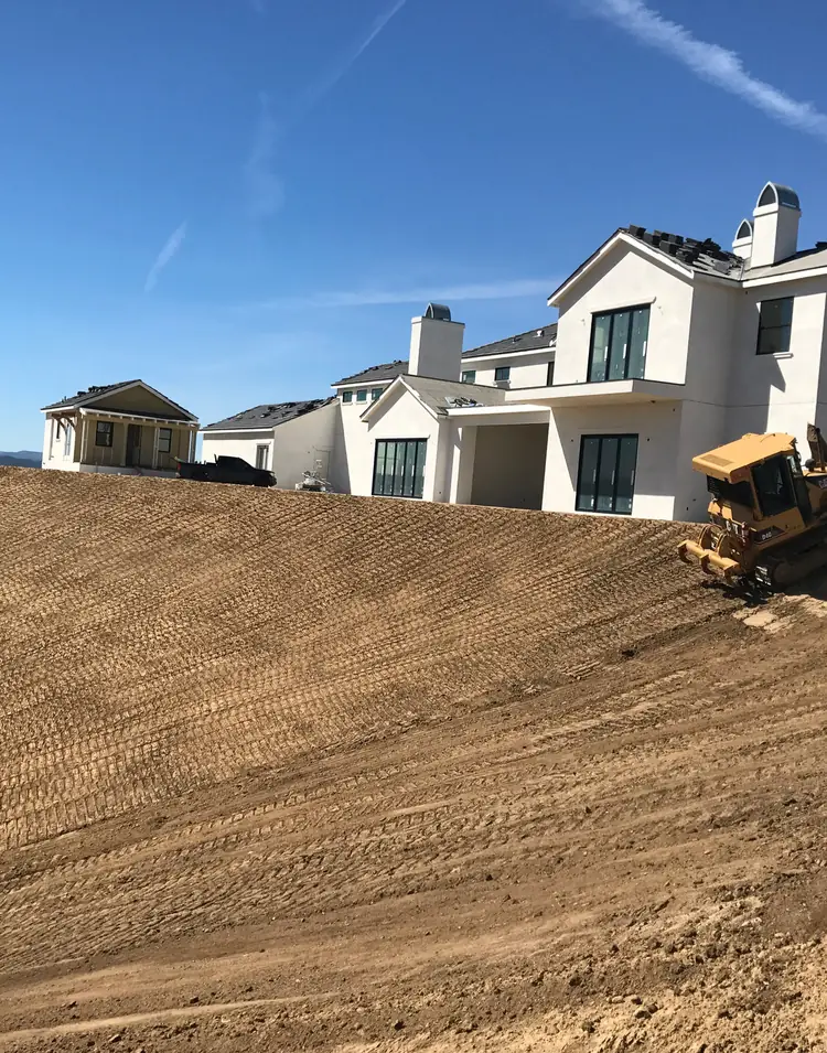 Finished custom home pad with dozer