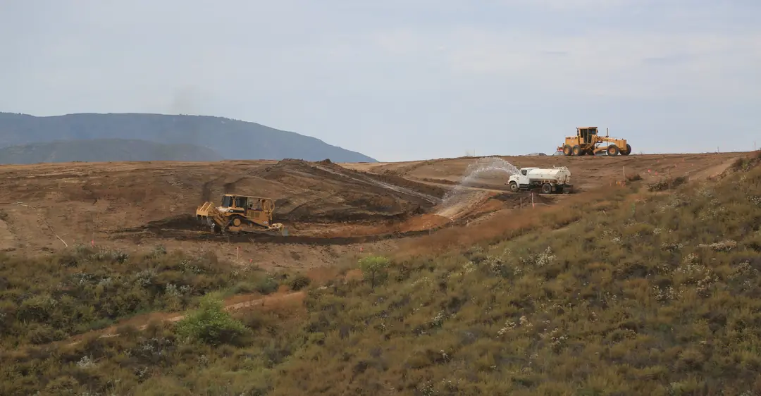 Grader working a hillside site