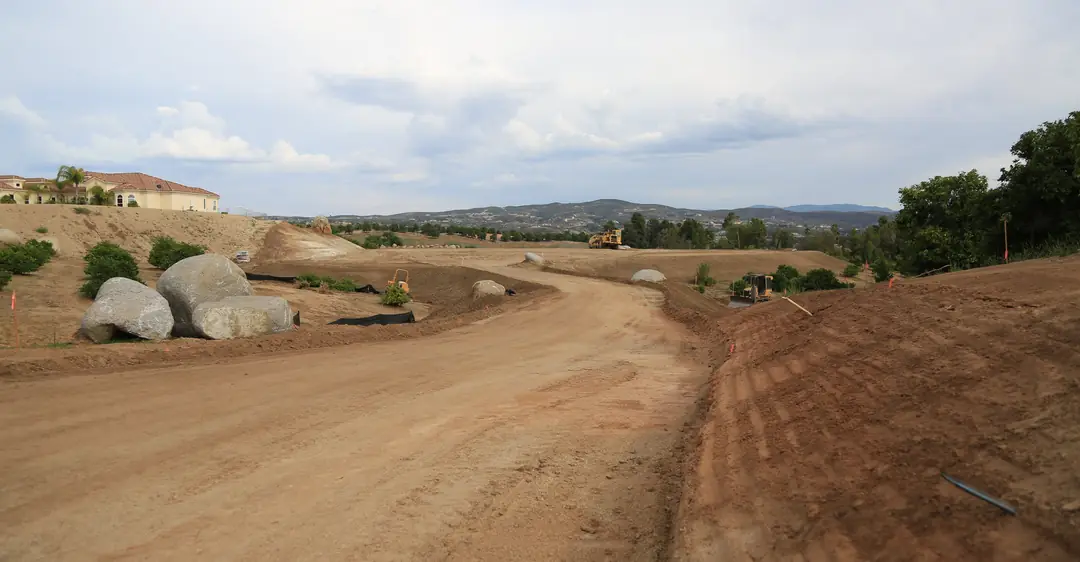 Graded access road through a property